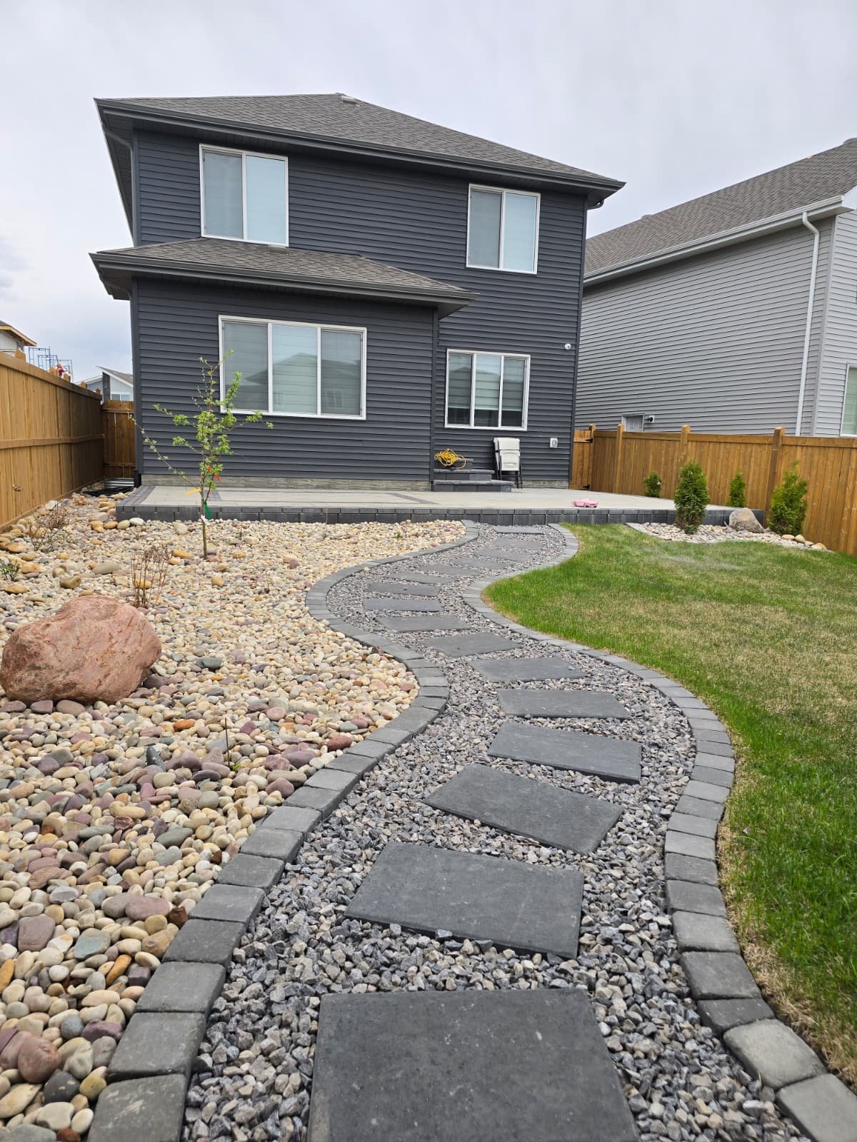 Stone stepper path through white and grey river rock — Edmonton