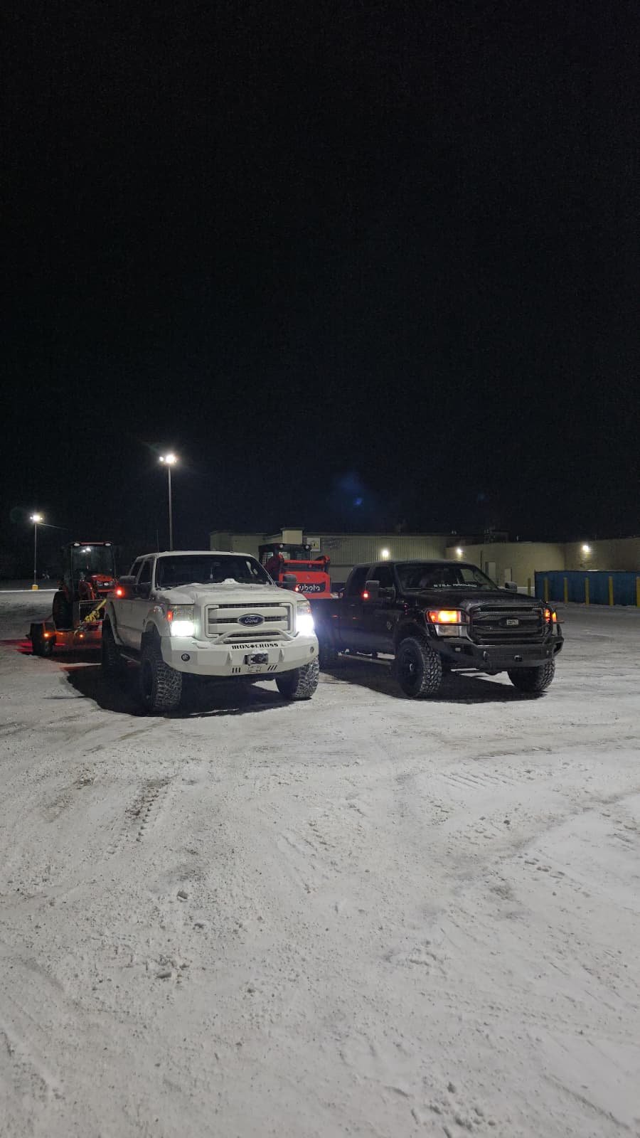 Garden Guys snow removal trucks ready for night operation in Edmonton